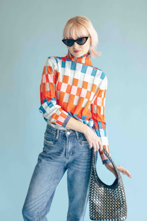 CHECKERBOARD TURTLENECK PULLOVER