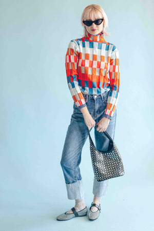 CHECKERBOARD TURTLENECK PULLOVER