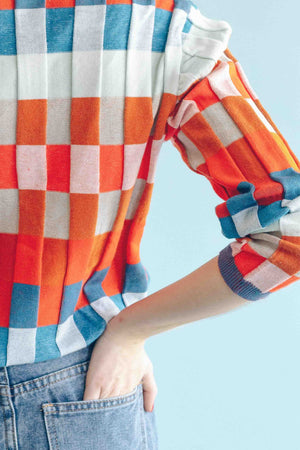 CHECKERBOARD TURTLENECK PULLOVER