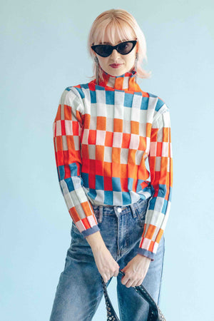 CHECKERBOARD TURTLENECK PULLOVER